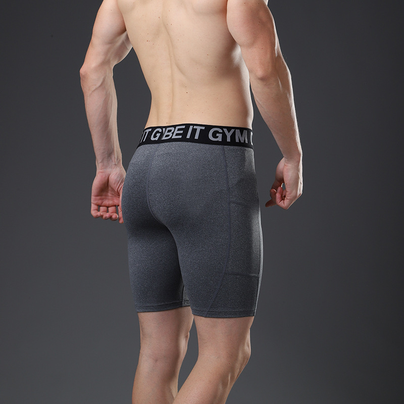 Pantalons de sport serrés pour hommes Pantalons à cinq points Entraînement de basket-ball Shorts de fitness Shorts à séchage rapide avec poches